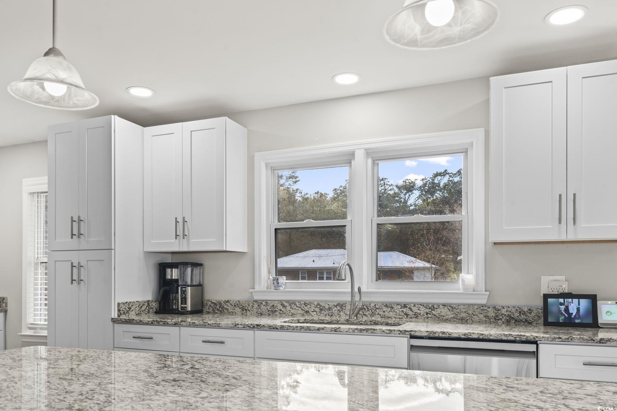 1673 Middleton Street Georgetown, SC 29440 - Photo 8 of 40 Kitchen with white cabinets, stainless steel dishw