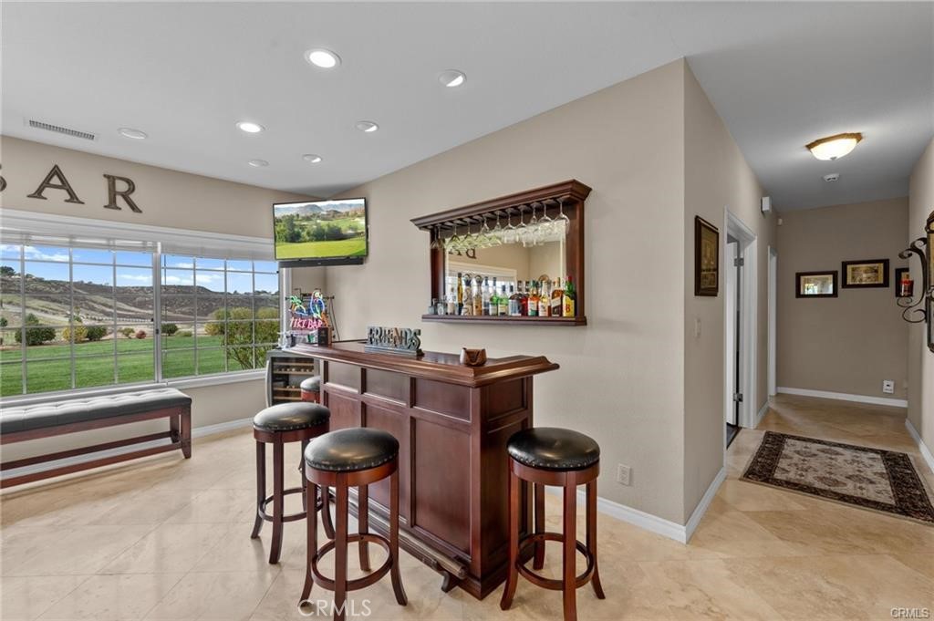 39581 Sperry Court Temecula, CA 92591 - Photo 14 of 63 a workspace with furniture and a floor to ceiling window