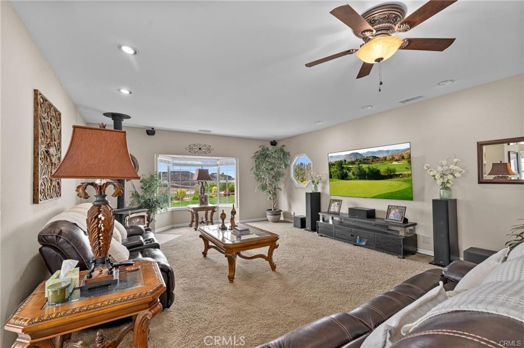39581 Sperry Court Temecula, CA 92591 - Photo 15 of 63 a living room with furniture and a flat screen tv