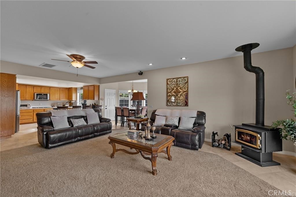 39581 Sperry Court Temecula, CA 92591 - Photo 18 of 63 a living room with furniture and a flat screen tv