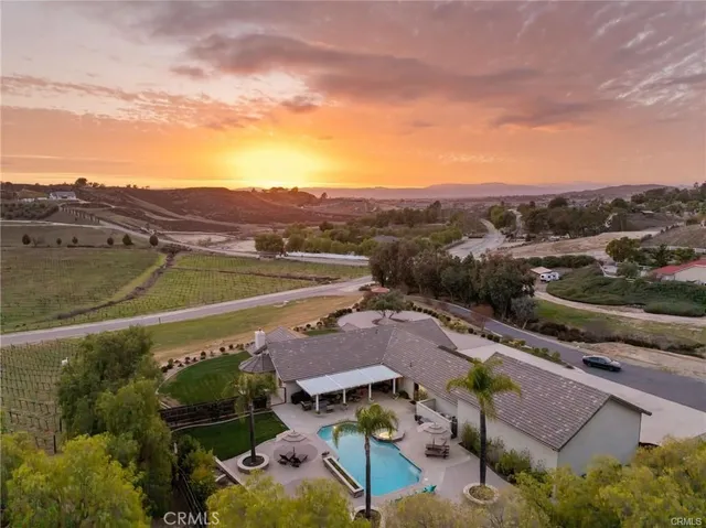 an aerial view of residential houses and outdoor space