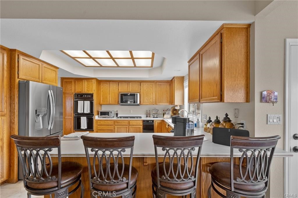 39581 Sperry Court Temecula, CA 92591 - Photo 22 of 63 a view of a dining room with furniture window and wooden floor