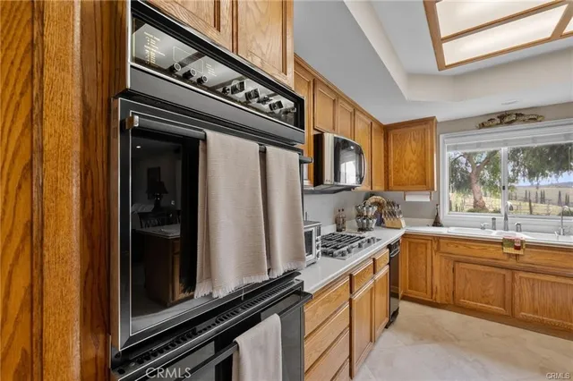 a spacious bedroom with a large bed and a window