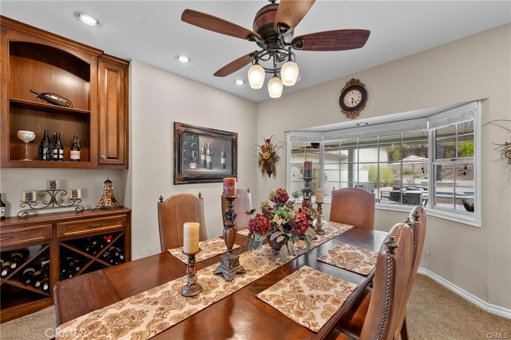 39581 Sperry Court Temecula, CA 92591 - Photo 26 of 63 a view of a dining room with furniture window and wooden floor