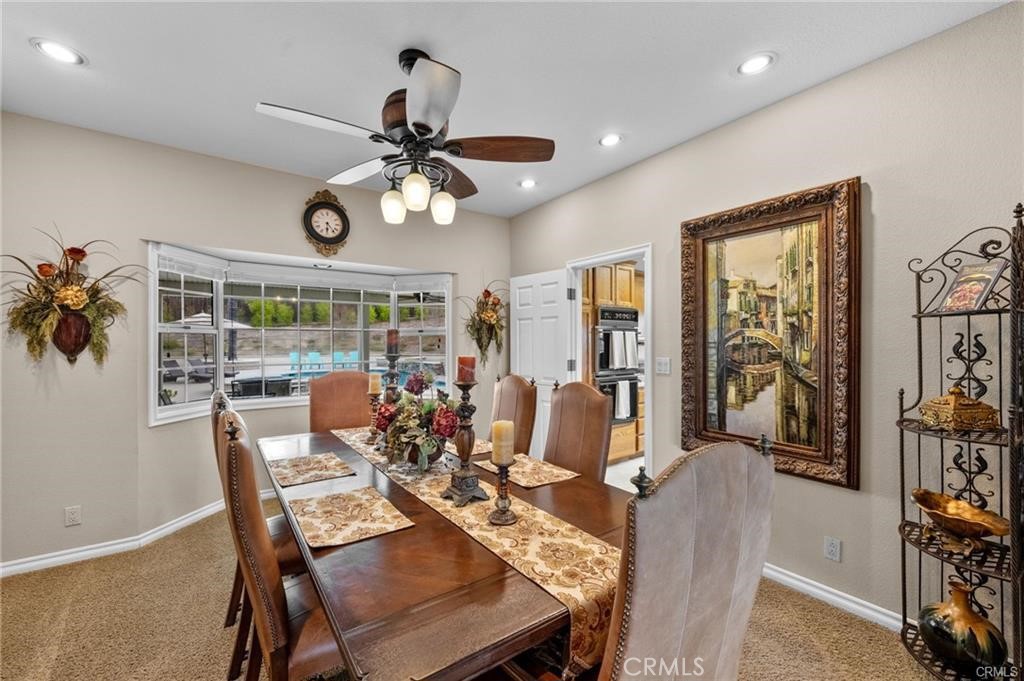 39581 Sperry Court Temecula, CA 92591 - Photo 27 of 63 a view of a dining room with furniture window and outside view