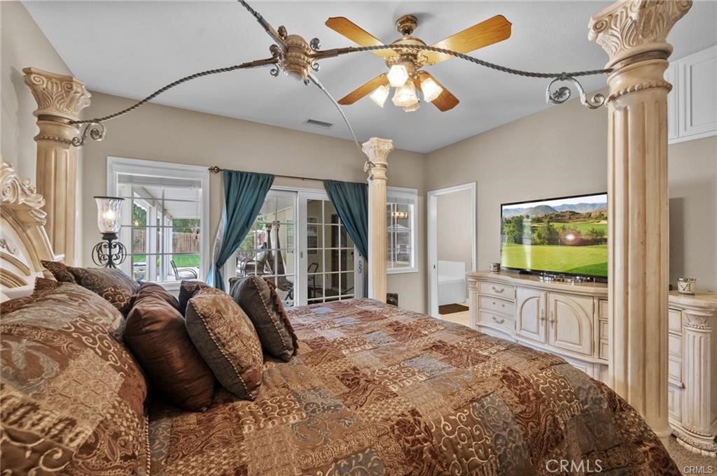 39581 Sperry Court Temecula, CA 92591 - Photo 30 of 63 a bed room with a bed window and a flat screen tv