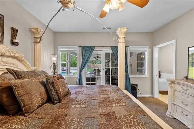 a bedroom with a bed and a couch