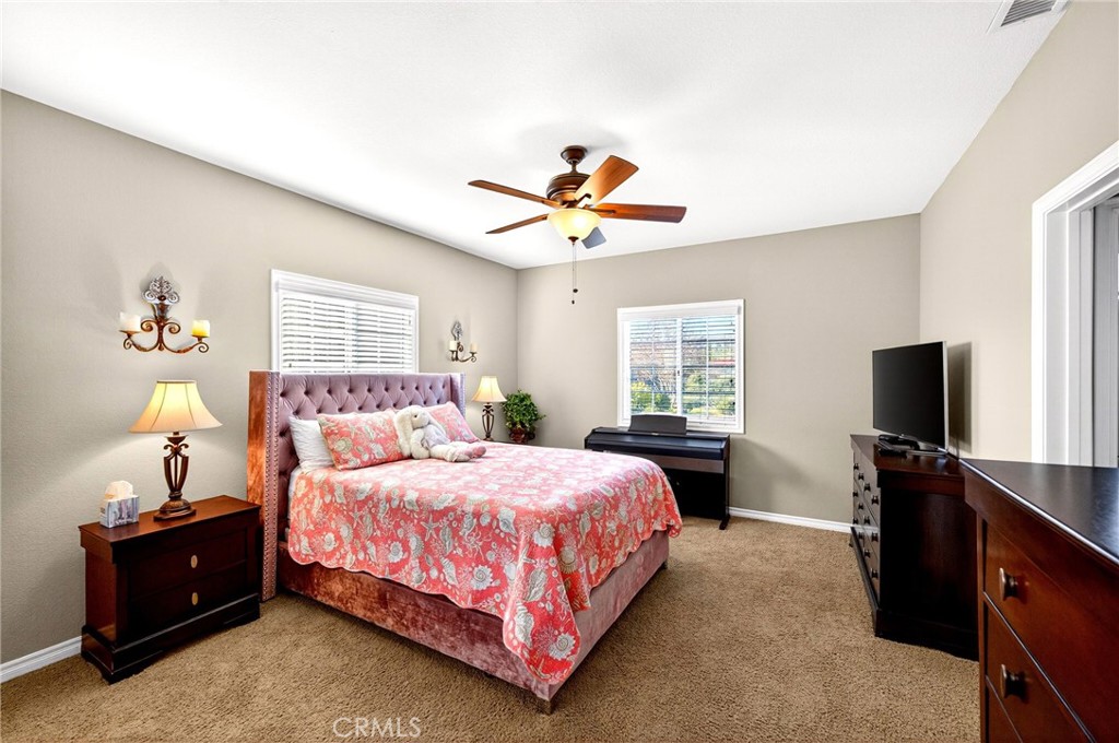 39581 Sperry Court Temecula, CA 92591 - Photo 36 of 63 a bedroom with a bed and a flat screen tv