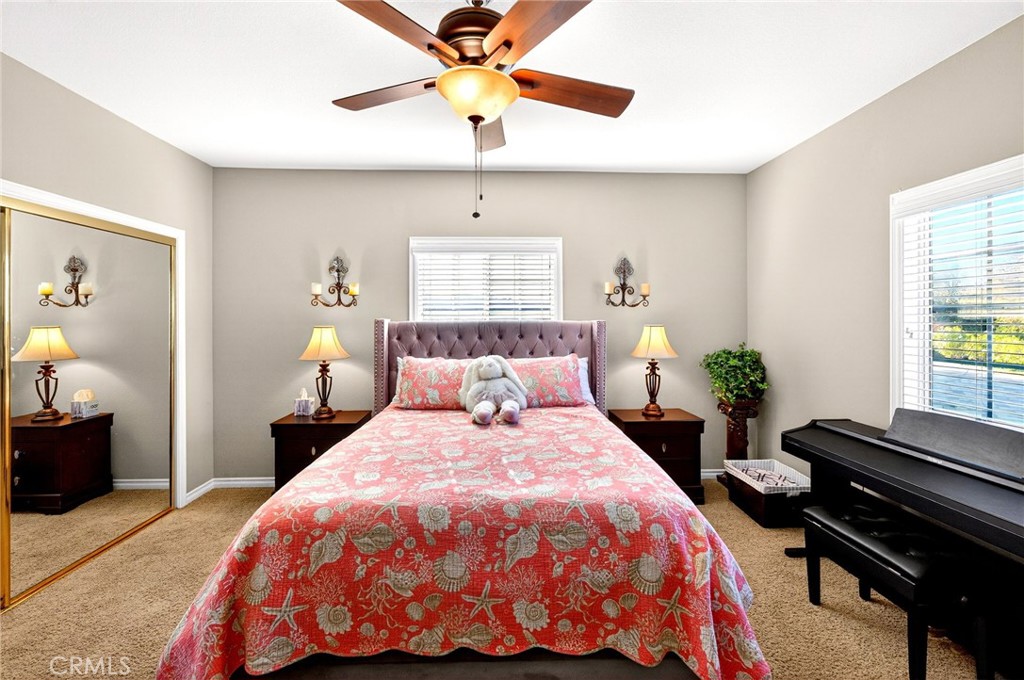 39581 Sperry Court Temecula, CA 92591 - Photo 37 of 63 a bedroom with a bed and a chandelier