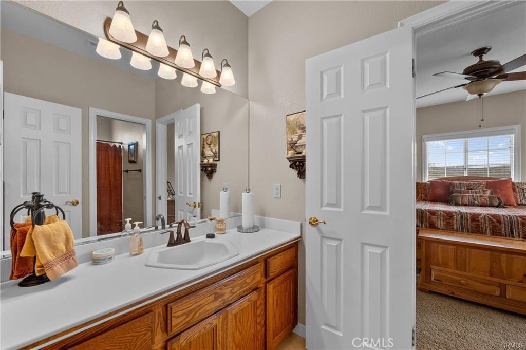 39581 Sperry Court Temecula, CA 92591 - Photo 43 of 63 a bathroom with a sink a vanity and a mirror