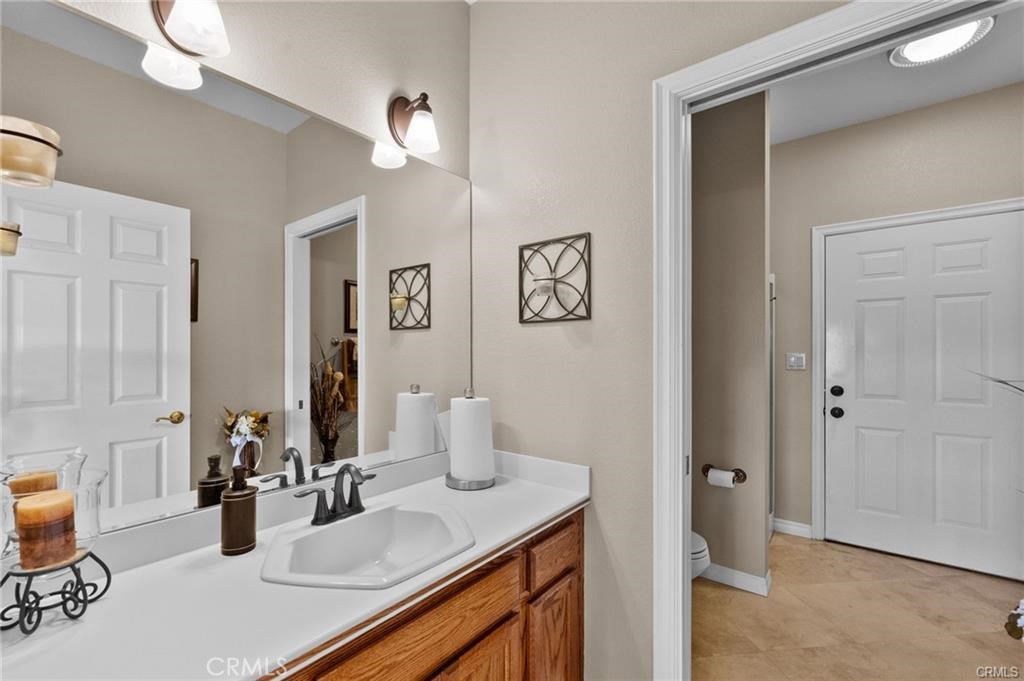39581 Sperry Court Temecula, CA 92591 - Photo 45 of 63 a kitchen with a sink and cabinets