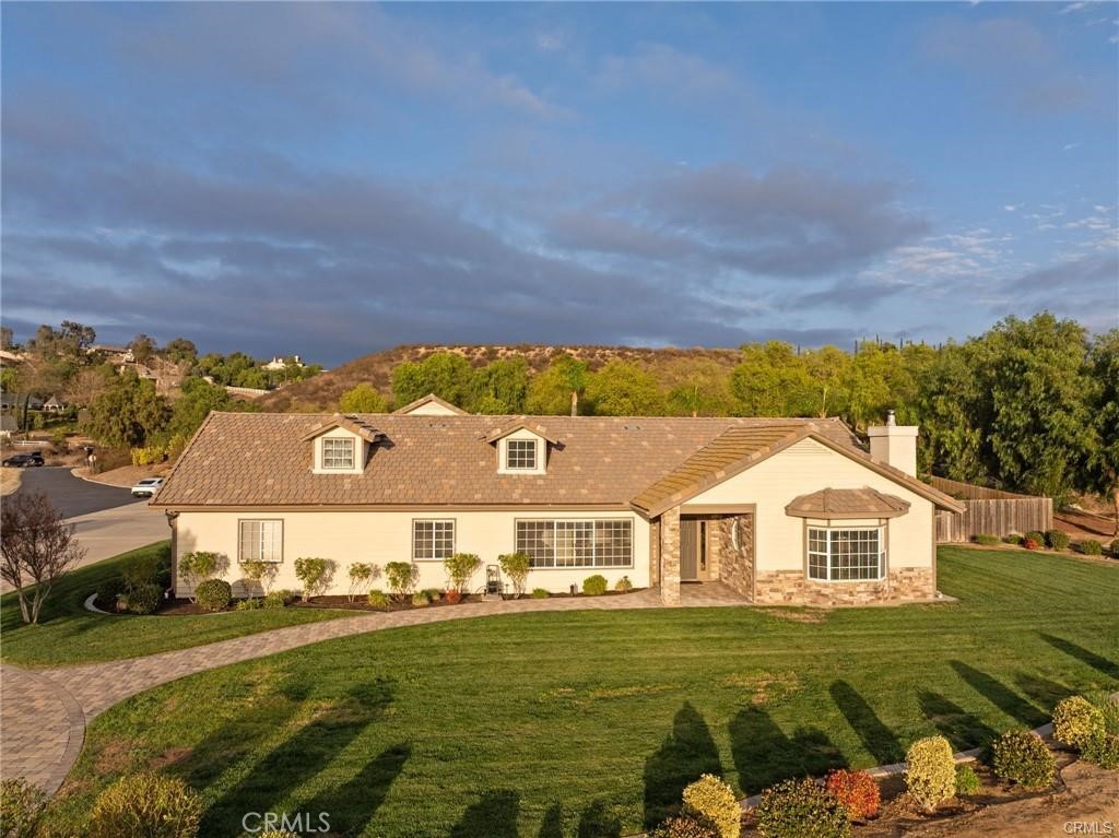 39581 Sperry Court Temecula, CA 92591 - Photo 57 of 63 a front view of a house with a garden