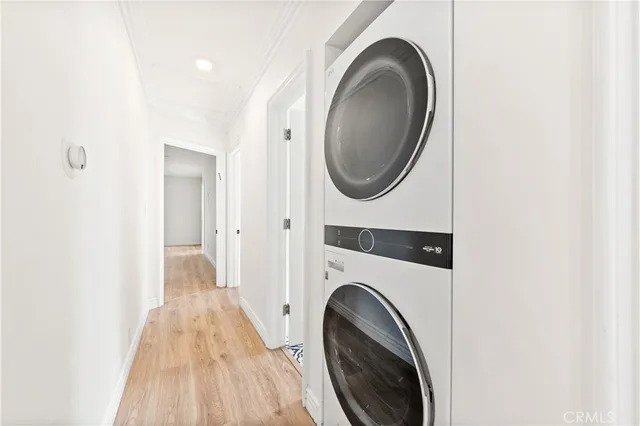 a view of a hallway with washer and dryer