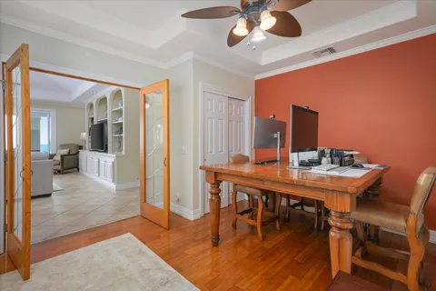 a bathroom with a granite countertop toilet sink mirror and vanity