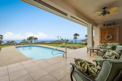 a view of a swimming pool and lounge chair