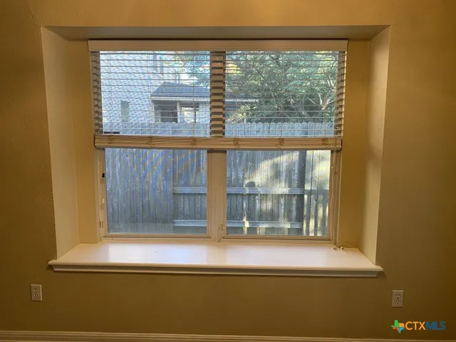 a view of a door and a window