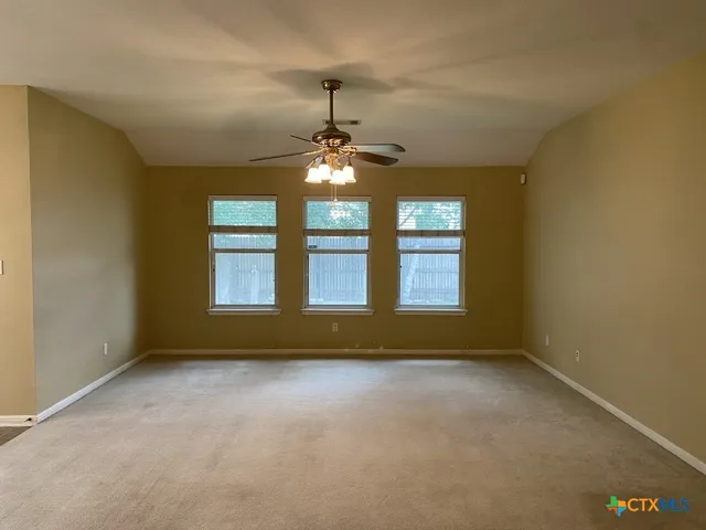 wooden floor and window in an empty room