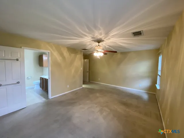 a view of a hallway with a chandelier