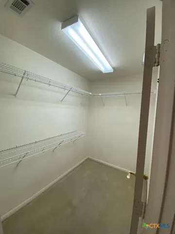 a view of a room with racks on the wall