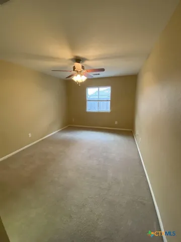 an empty room with a empty space and windows