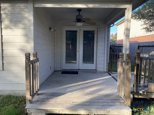 a view of a backyard with a small cabin and a chair