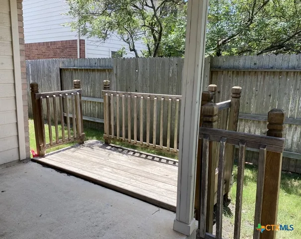 a view of outdoor space with a wooden fence