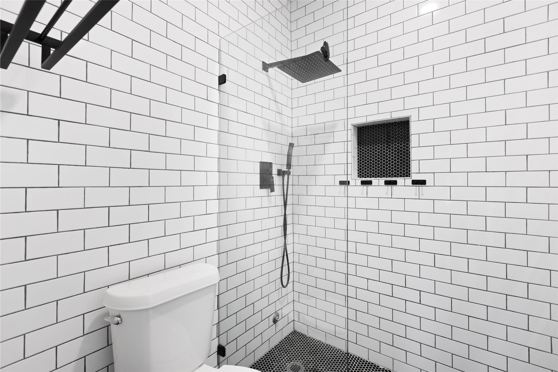 2100 Tanglewilde Street, Unit 378 Houston, TX 77063 - Photo 20 of 25 Shower so sleek you’ll feel like you’re in a boutique hotel. Bonus: throne included