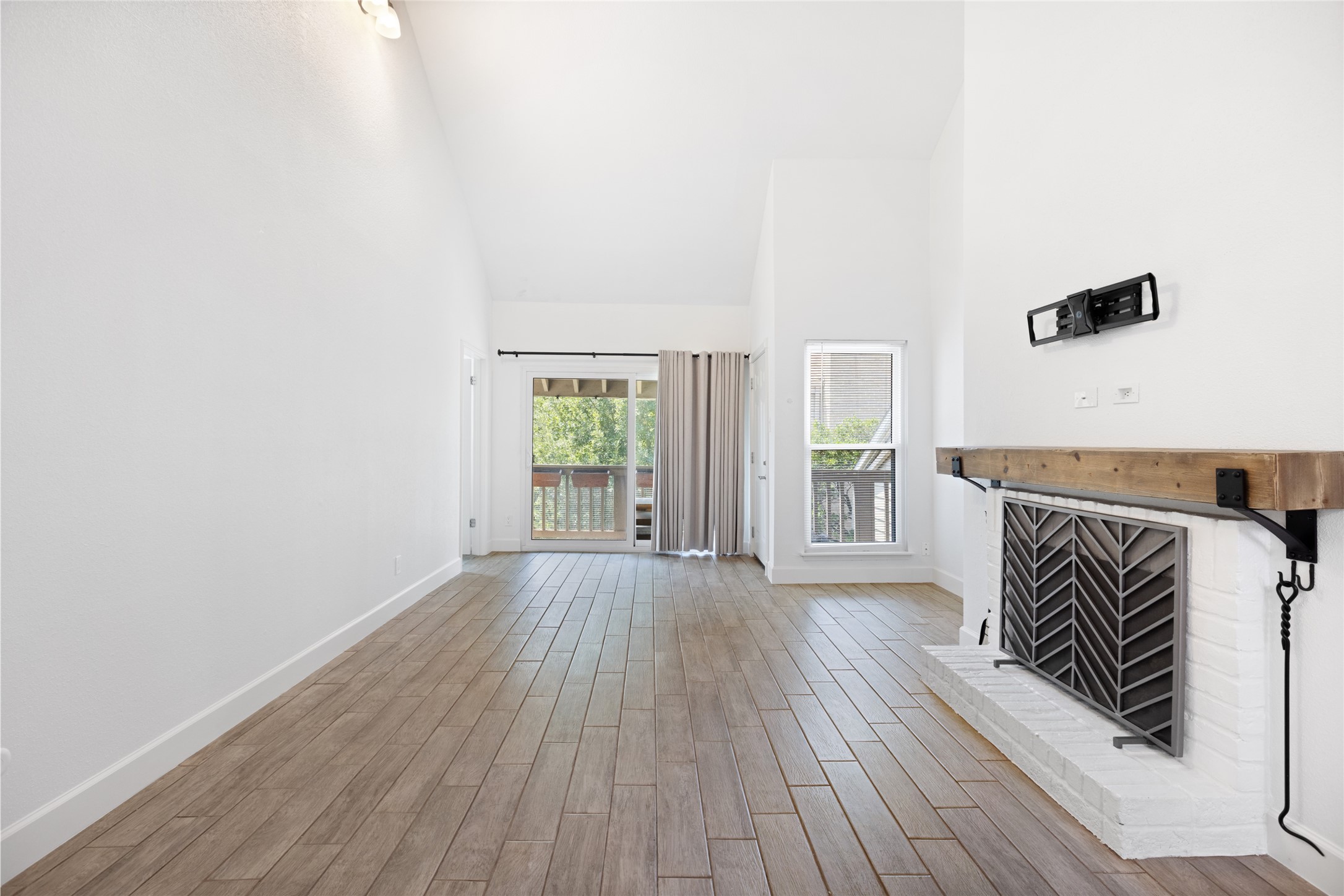 2100 Tanglewilde Street, Unit 378 Houston, TX 77063 - Photo 5 of 25 Vaulted ceilings + fireplace = the ultimate Netflix binge lair.