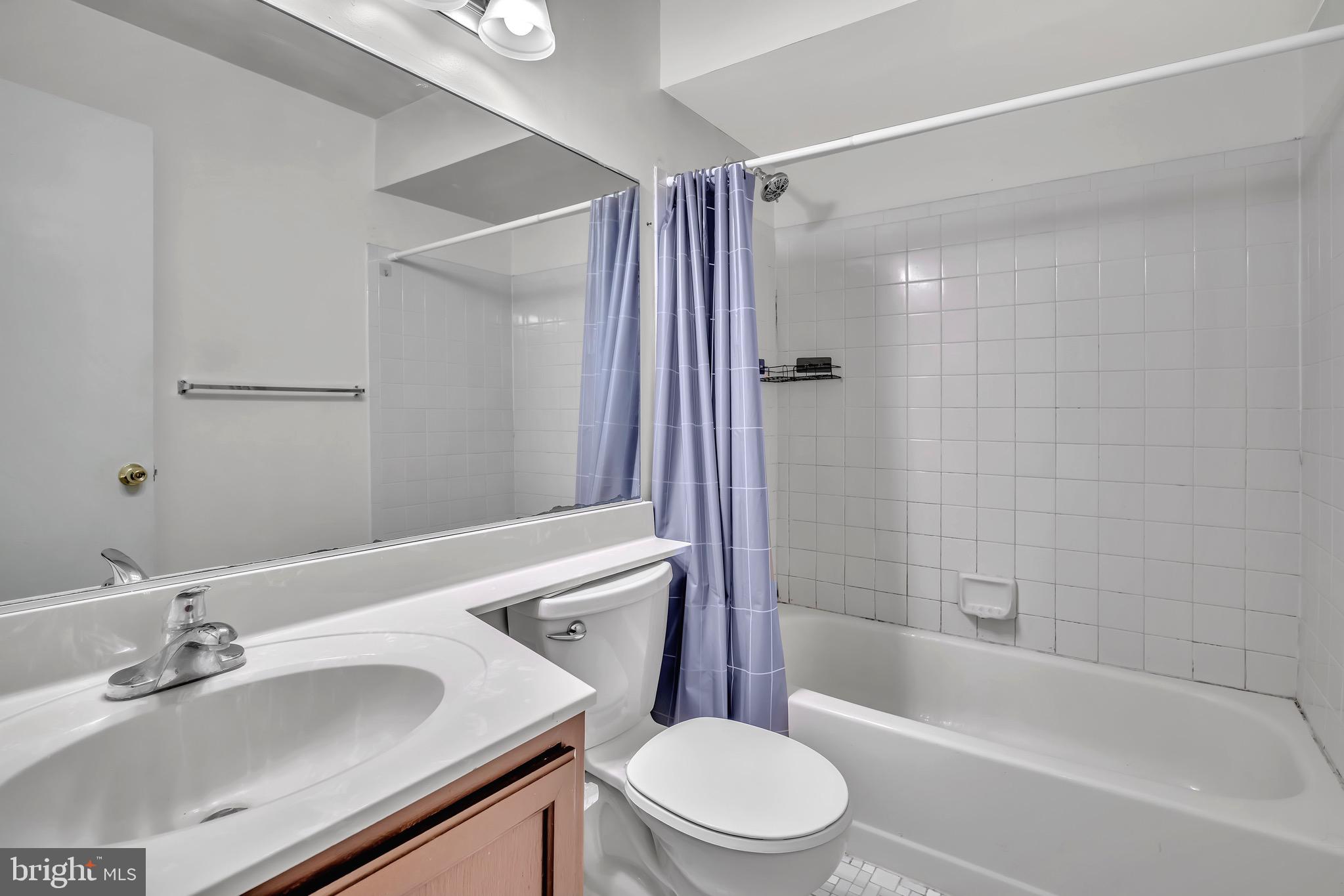 302 Trinity Court, Unit 8 Princeton, NJ 08540 - Photo 13 of 17 a bathroom with a sink toilet and shower