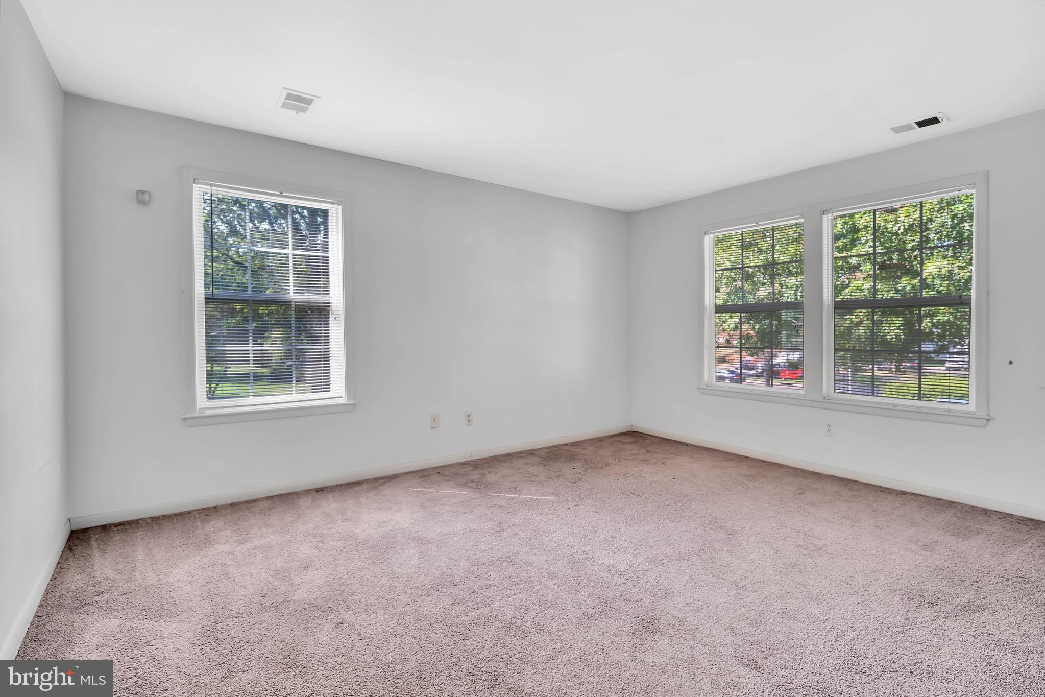 302 Trinity Court, Unit 8 Princeton, NJ 08540 - Photo 9 of 17 a view of an empty room with a window