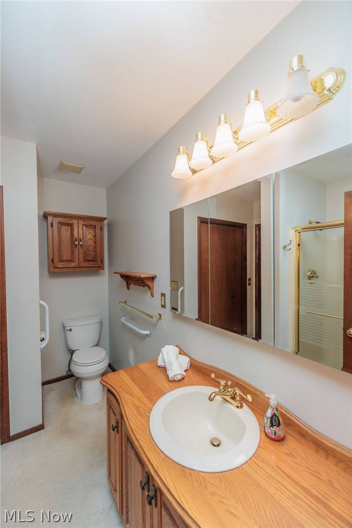 425 Bittersweet Road Akron, OH 44333 - Photo 19 of 50 Bathroom with vanity, an enclosed shower, and toilet