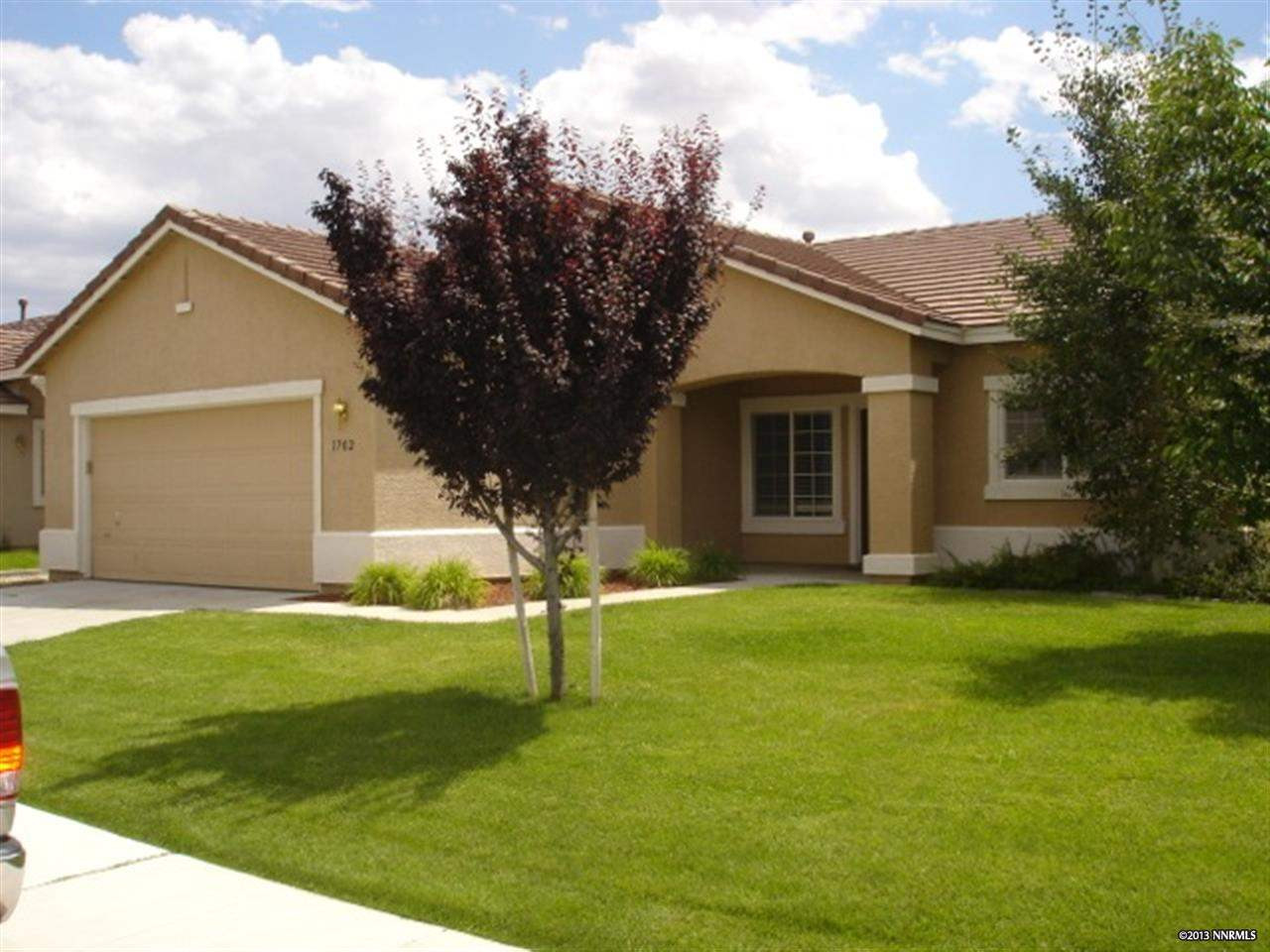 1702 Trek Trail Reno, NV 89521 - Photo 1 of 1 a backyard of a house with garden and plants