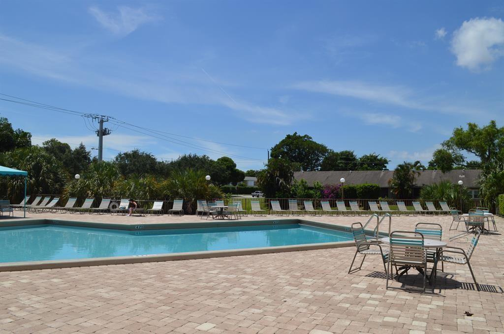 2901 Fiore Way, Unit 107 Delray Beach, FL 33445 - Photo 11 of 13 a view of a lake with outdoor space