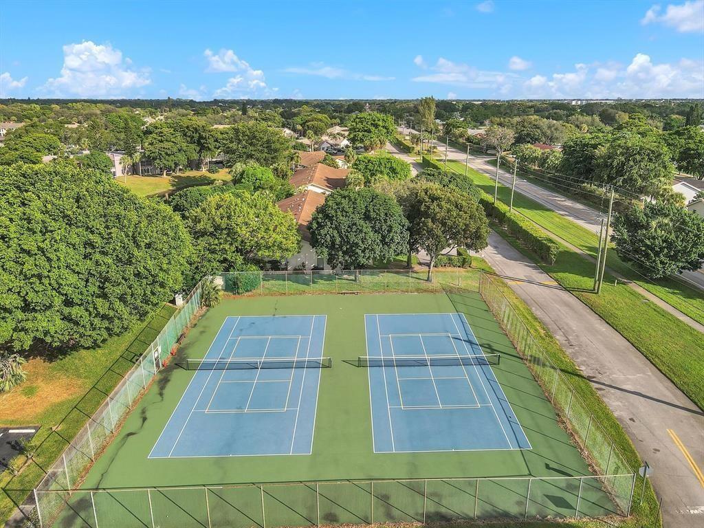 2901 Fiore Way, Unit 107 Delray Beach, FL 33445 - Photo 12 of 13 a view of an outdoor space and a lake view