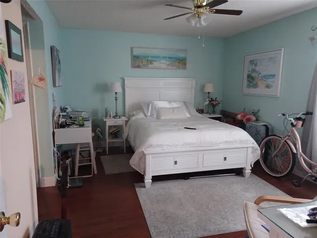 a bed room with a bed and a chair