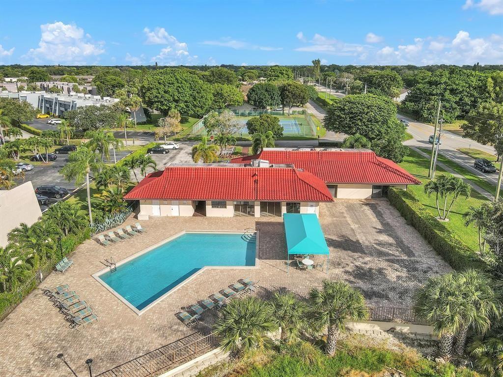 2901 Fiore Way, Unit 107 Delray Beach, FL 33445 - Photo 9 of 13 a view of a balcony with an outdoor space and garden
