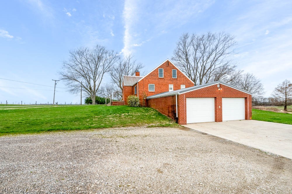 23814 Georgetown Road Homeworth, OH 44634 - Photo 17 of 25 Front of property with a front lawn and a garage