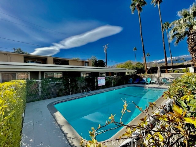 37111 Cathedral Canyon Drive, Unit 1 Cathedral City, CA 92234 - Photo 19 of 19 a view of a swimming pool with a patio