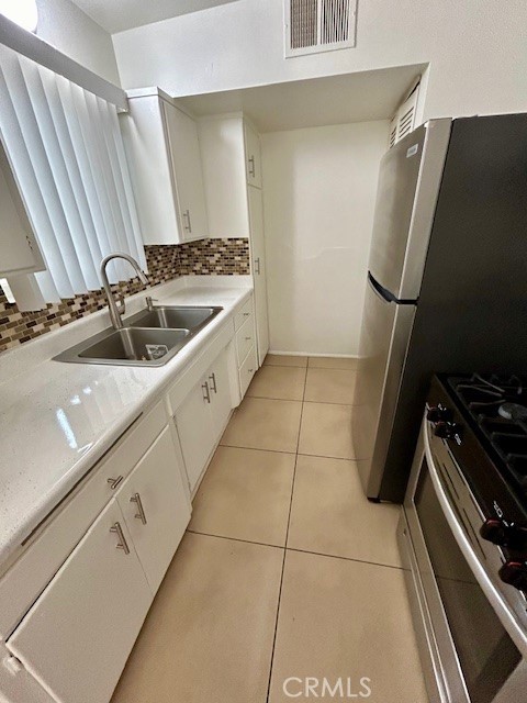 37111 Cathedral Canyon Drive, Unit 1 Cathedral City, CA 92234 - Photo 7 of 19 a kitchen with a sink appliances and cabinets