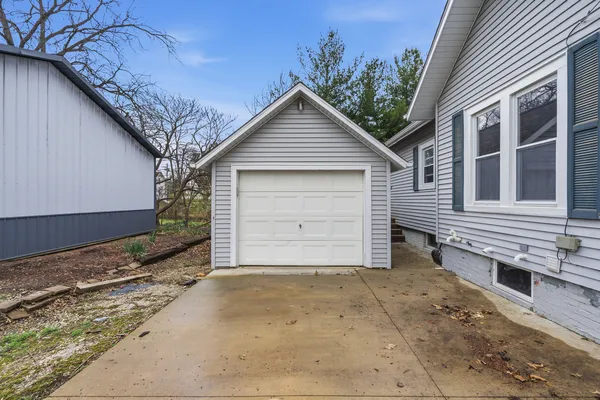 a view of a brick house with a large window