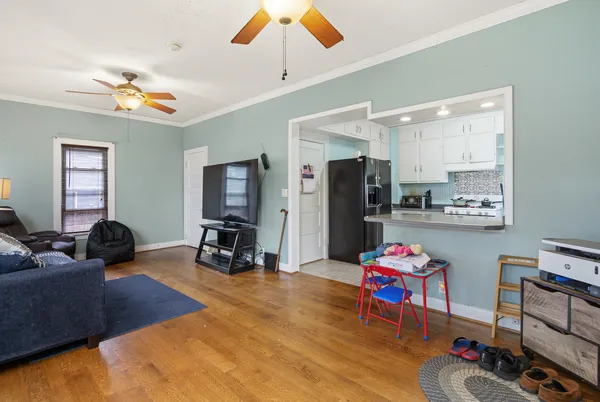 a living room with furniture and a flat screen tv
