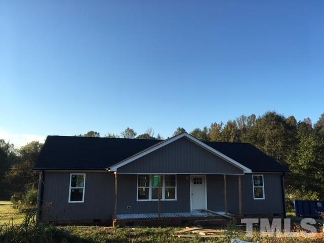 5017 West Pool Road Rougemont, NC 27572 - Photo 1 of 4 a front view of a house with a yard
