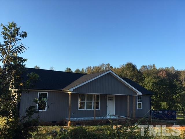 5017 West Pool Road Rougemont, NC 27572 - Photo 2 of 4 a front view of a house with a garden