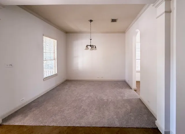 a view of a big room with windows