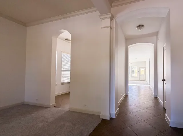 a view of a balcony with yard