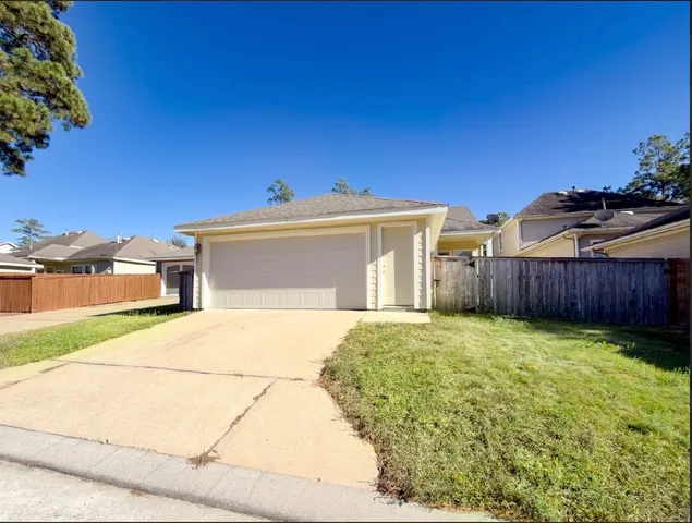 a view of a house with backyard and porch