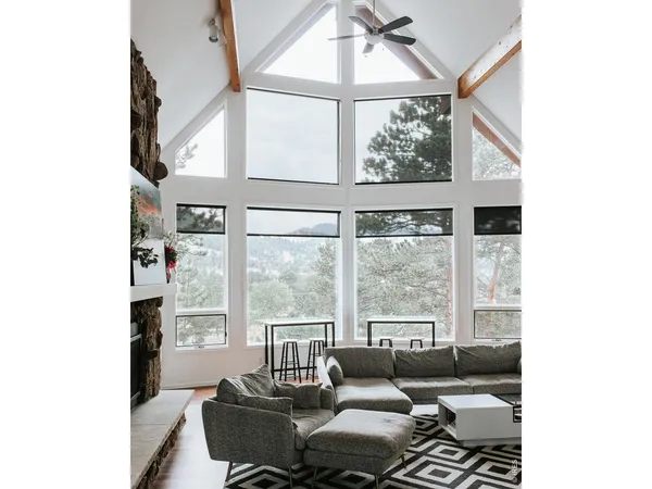 a bedroom with a bed a flat screen tv and a book shelf