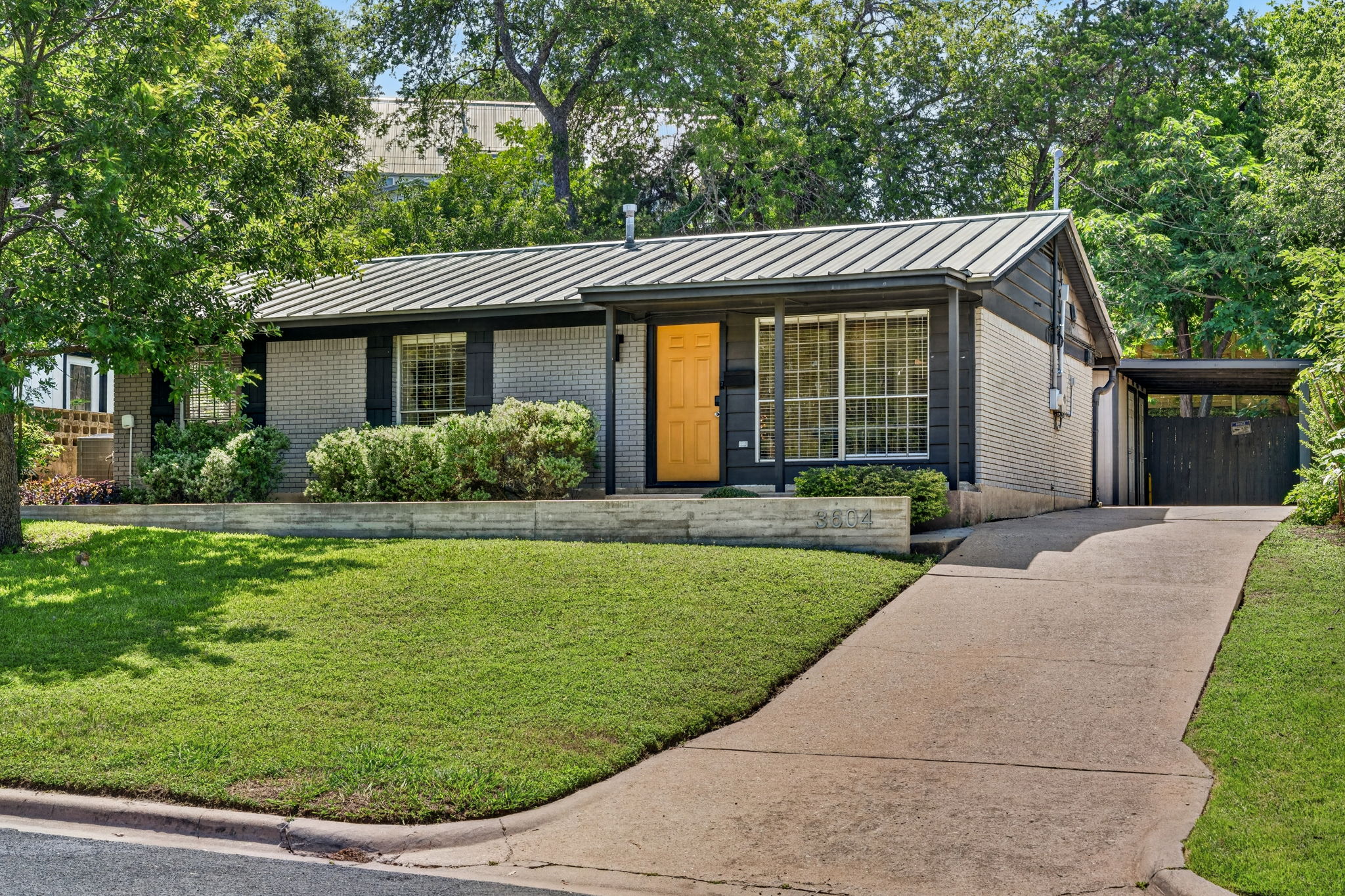 3604 Wilson Street Austin, TX 78704 - Photo 2 of 25 a front view of a house with garden