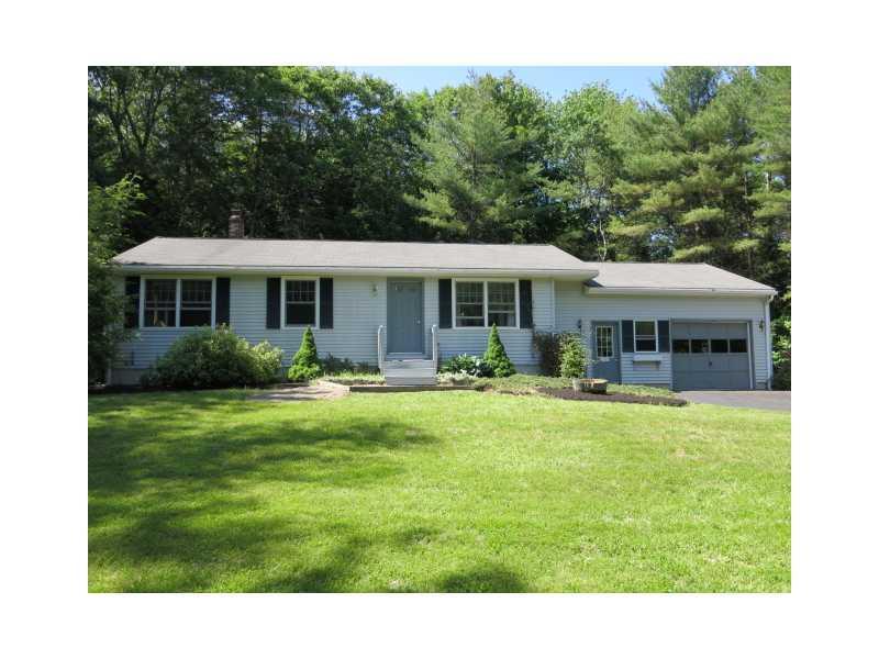 Exterior Front. Set back from the...