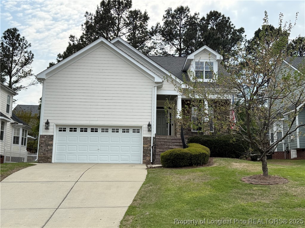 a front view of a house with a garage